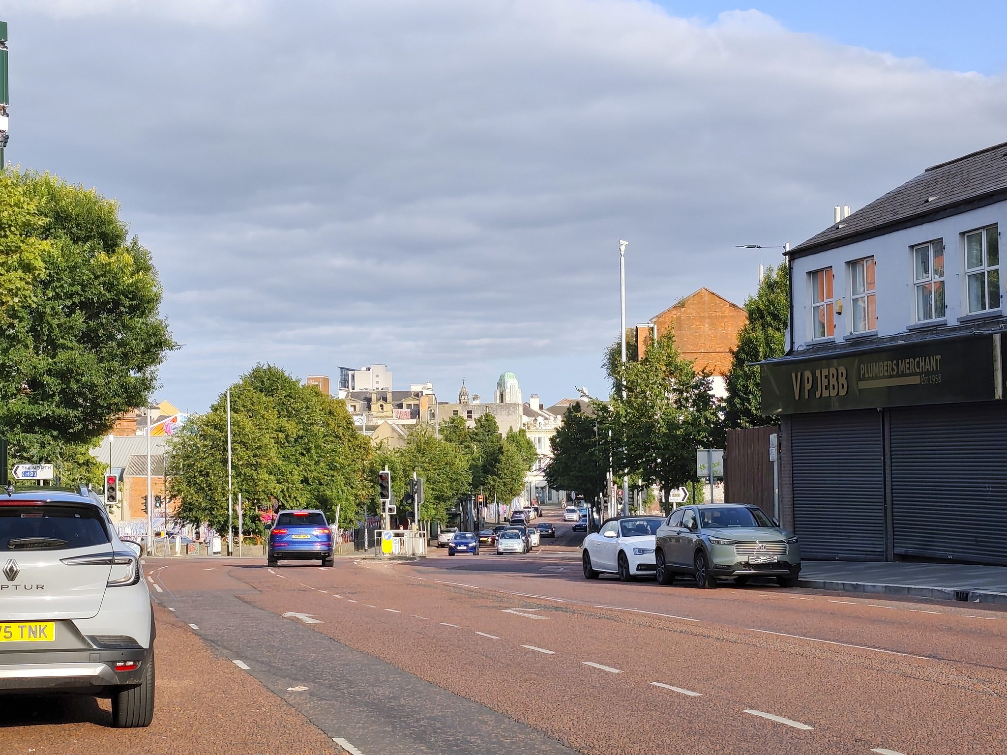 Looking down Peters Hill towards the city centre: tree-lined road, the CastleCourt dome and city buildings a few minutes' walk away.